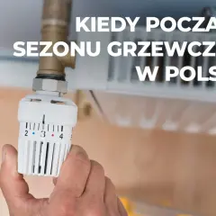 Dłoń reguluje termostat grzejnika, przygotowując dom na zimę. Kiedy zaczyna się sezon grzewczy w Polsce?