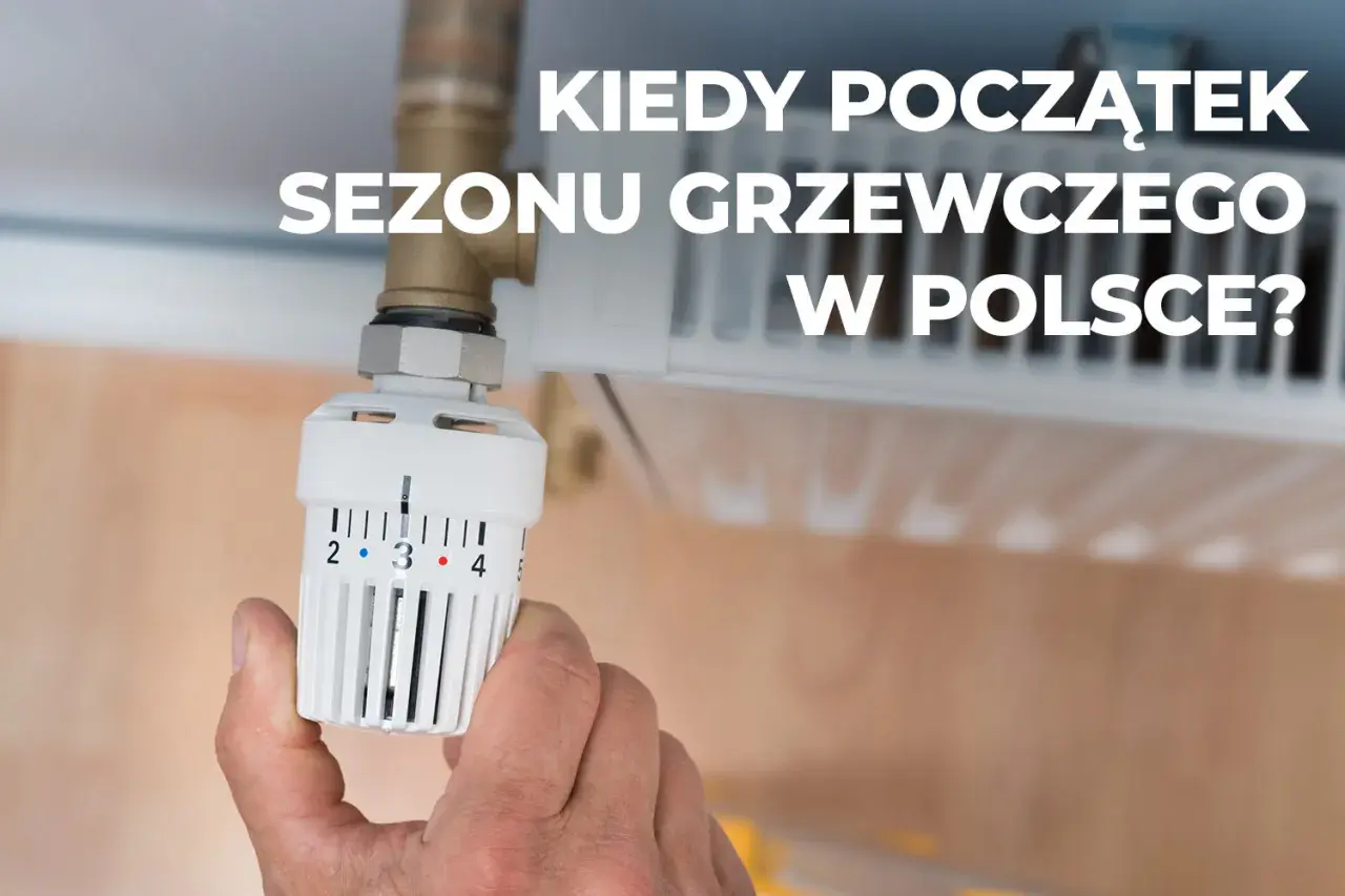Dłoń reguluje termostat grzejnika, przygotowując dom na zimę. Kiedy zaczyna się sezon grzewczy w Polsce?